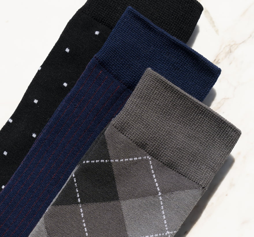 Click to shop Florsheim accessories. Image features a variety of Florsheim socks.