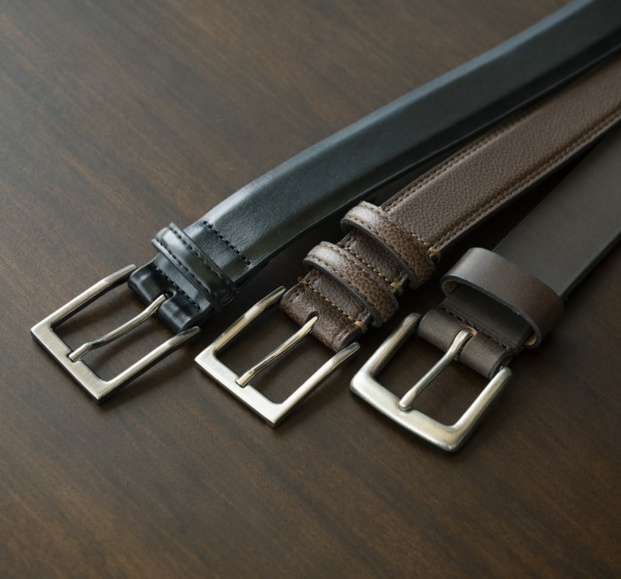 Click to shop Florsheim accessories. Image features a variety of Florsheim belts. 