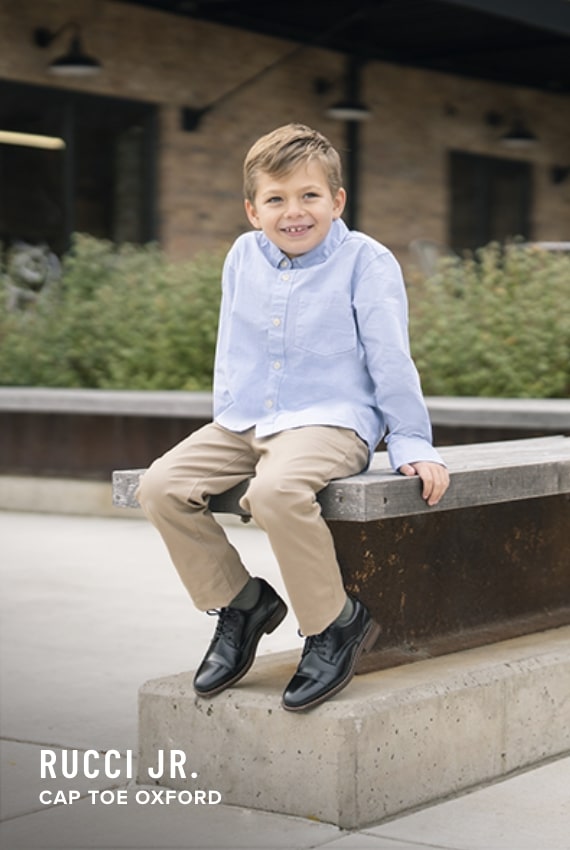 Boy's Dress Shoes category. Image features the Rucci Jr in black. 