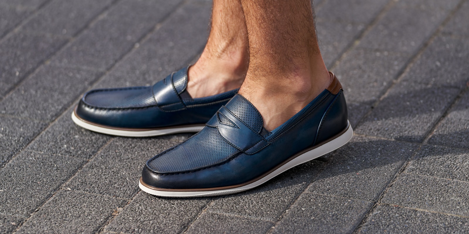 The featured image is the Atlantic Moc Toe Penny Loafer in Navy.