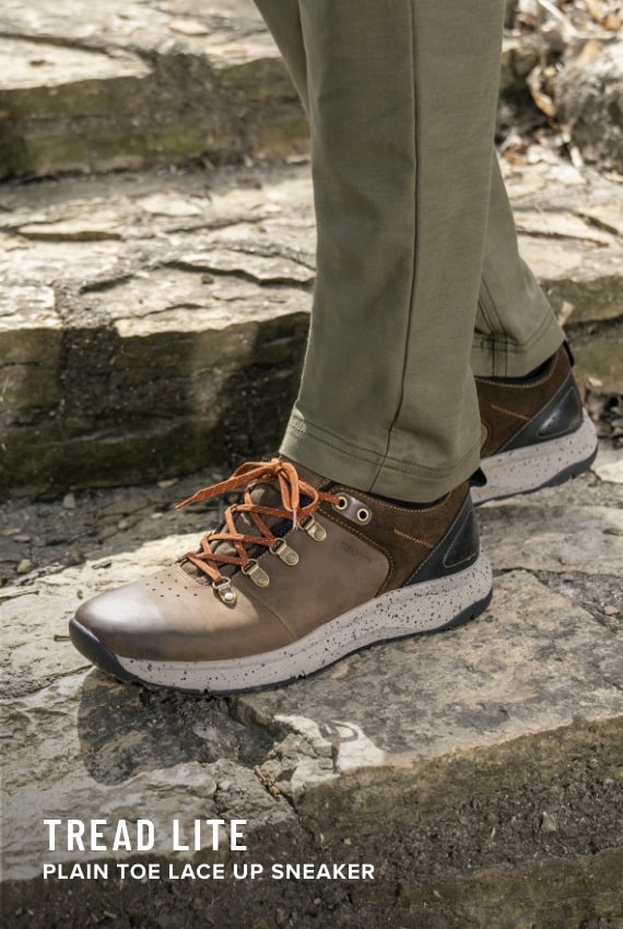 Shoes for Men view all category. Image features the Tread Lite sneaker in brown. 