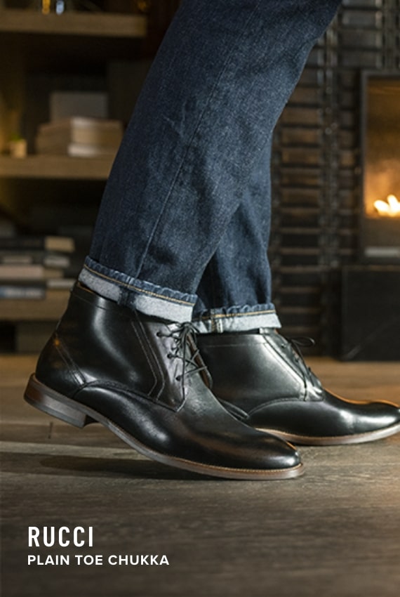 Shoes for Men view all category. Image features the Rucci chukka in black.