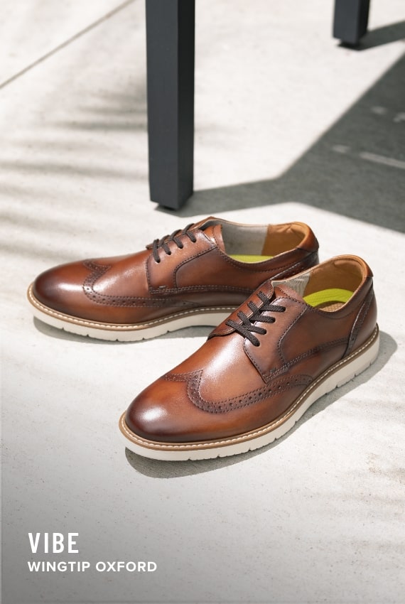 Shoes for Men view all category. Image features the Vibe wingtip in cognac.