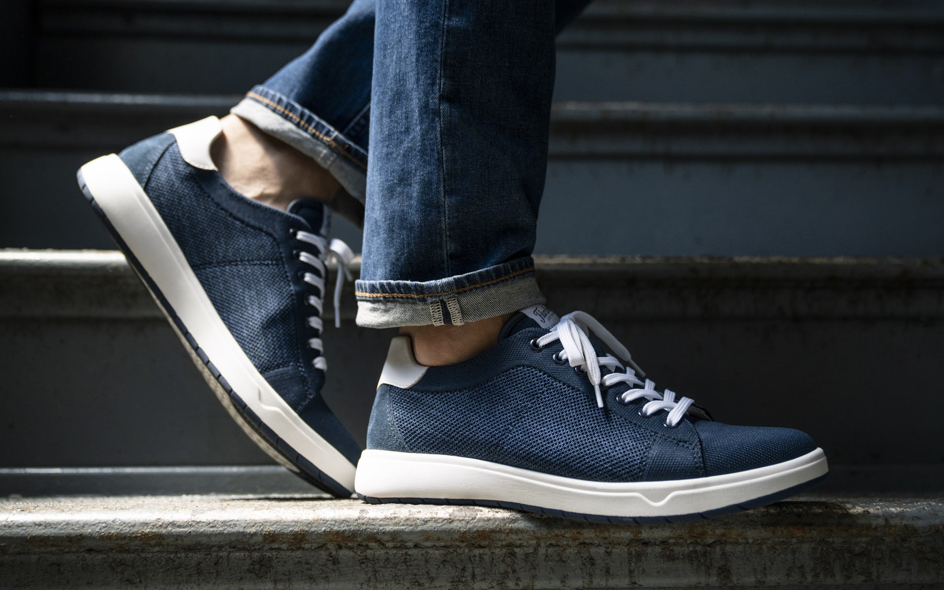 Click to shop the Heist collection. Image features the Heist Knit Sneaker in navy. 