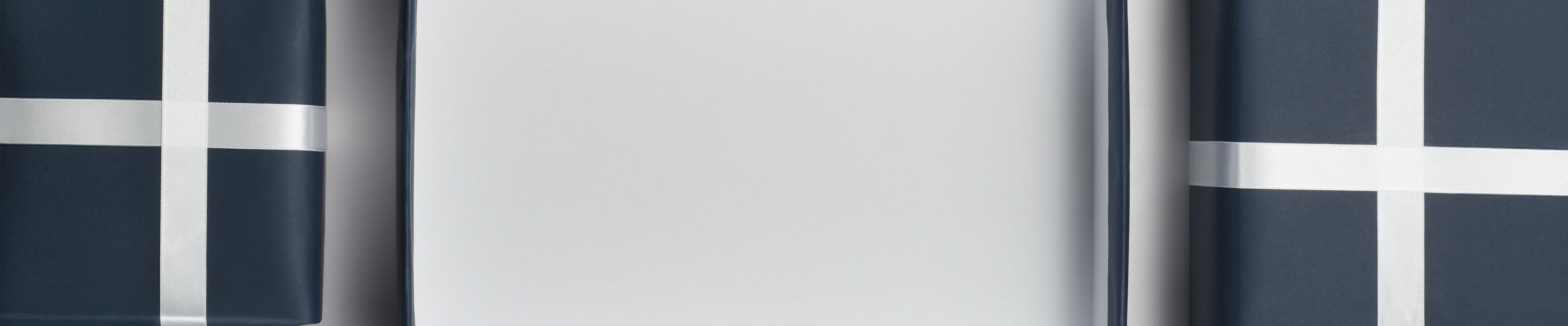 Shop 15% off and free 2 day shipping featuring a navy and silver background with wrapped gifts.