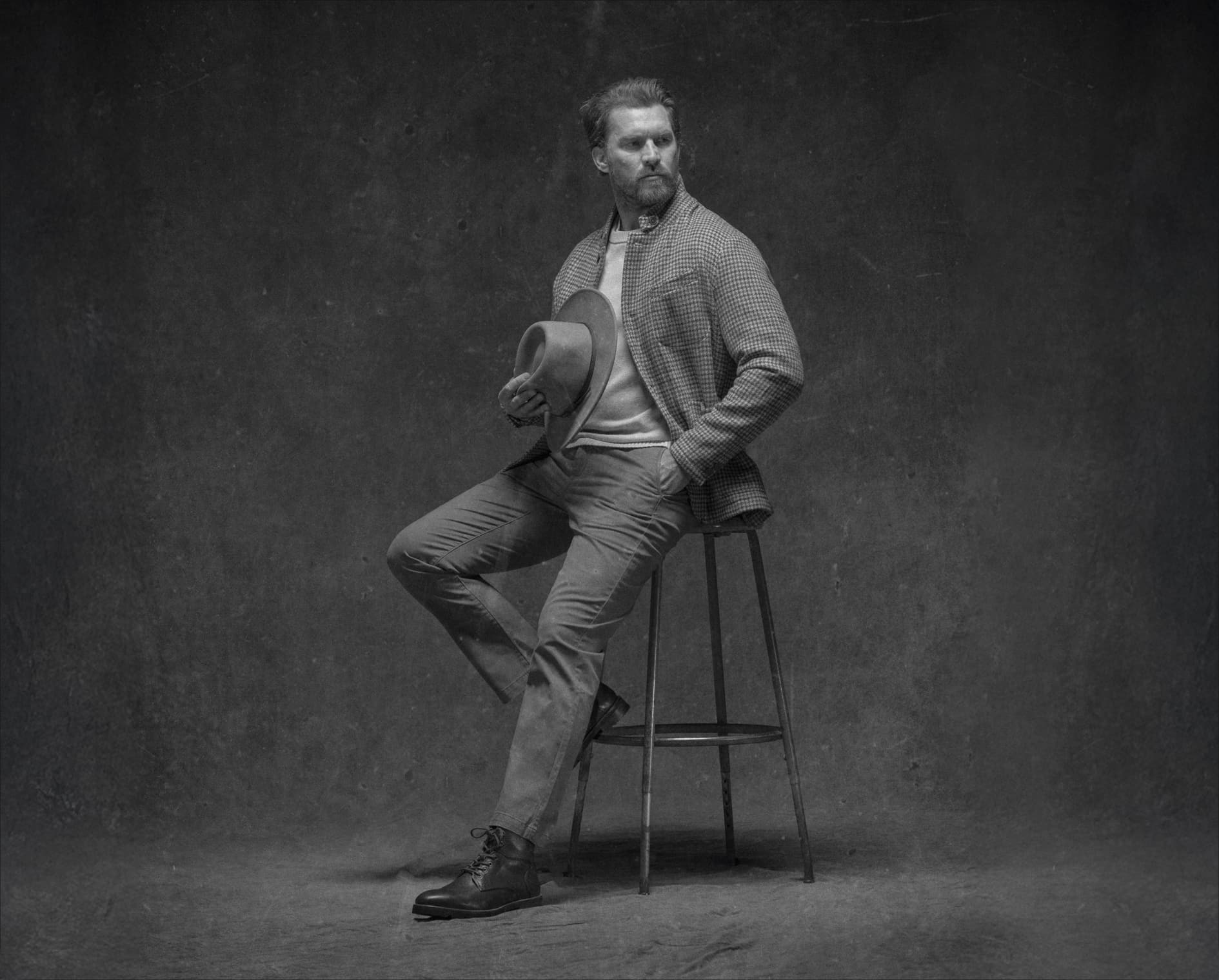 Image features a man on a stool wearing the Renegade Lux boot.