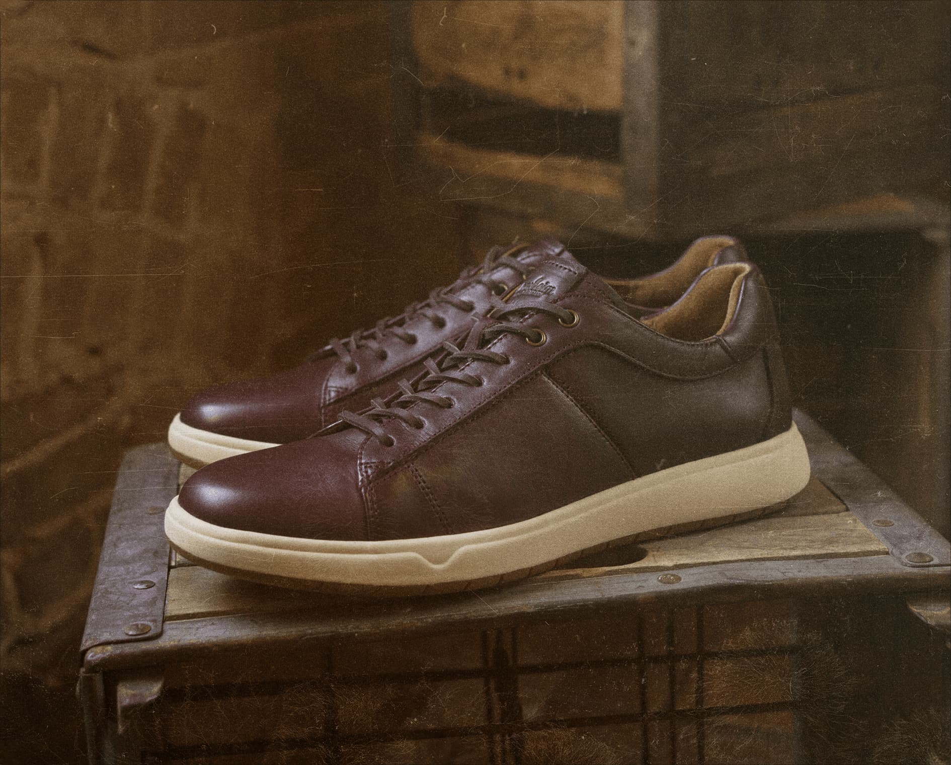 Image features the Heist Lux sneaker in brown on a wood crate.