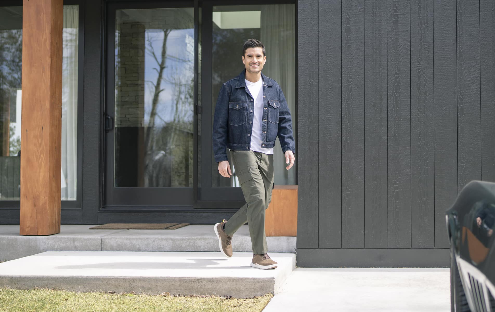 Shop Florsheim casuals featuring a man walking out of a house.