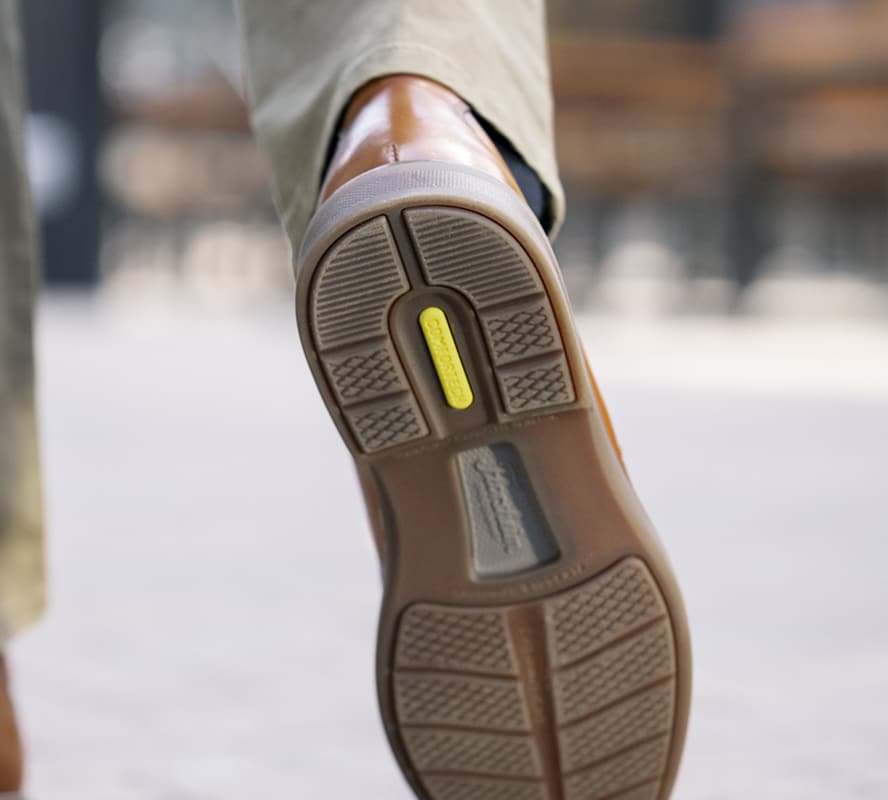 Shop the Florsheim Comfortech Category featuring the HighRise sole walking away.