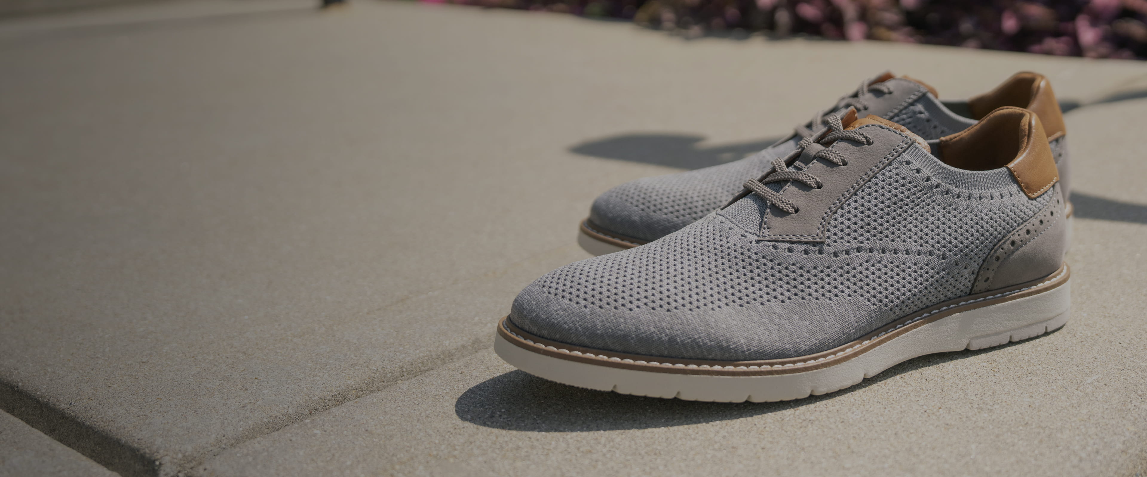 Florsheim view all featuring the Vibe Knit in grey on a sidewalk.