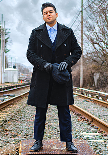 Image of social media influencer Diego Leon standing on railroad tracks while wearing the Highland Plain Toe Oxford in Black CH.