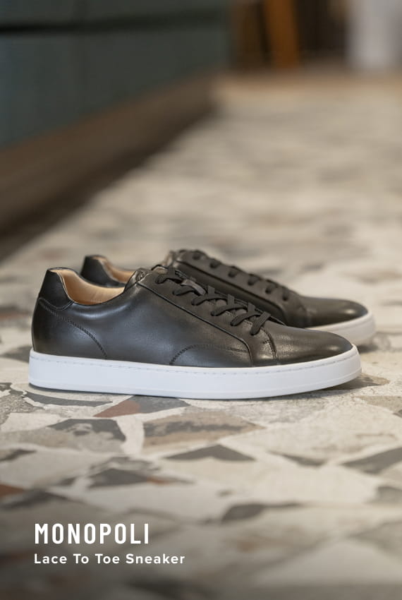 Men's Hybrids category. Image features the Monopoli sneaker in black.