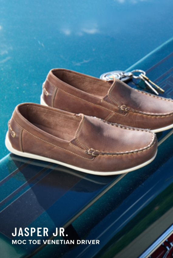 Boy's Uniform Shoes category. Image features the Jasper Jr Moc Toe Venetian loafer in brown.