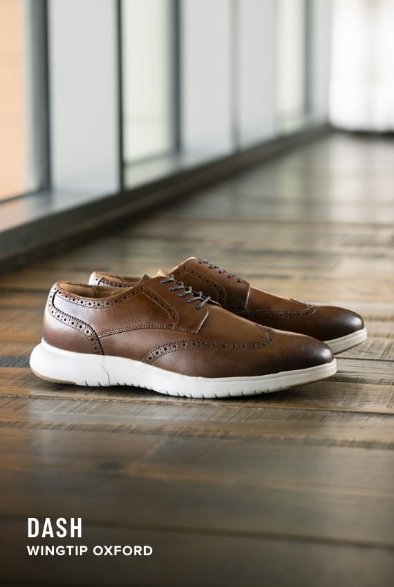 Wedding Picks Image features the Dash Wingtip Oxford on a wood floor. 