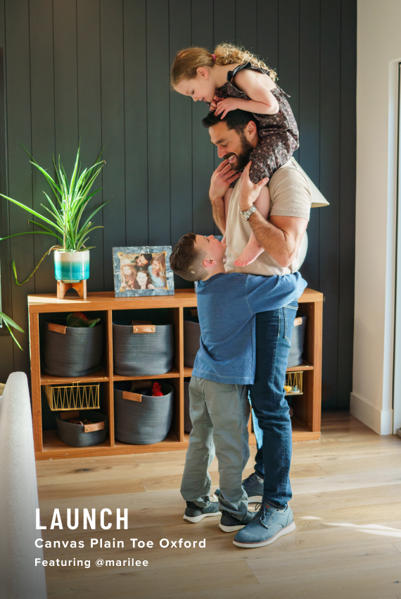 Father's Day Picks Image features a man and kids shoes propped on an ottoman.