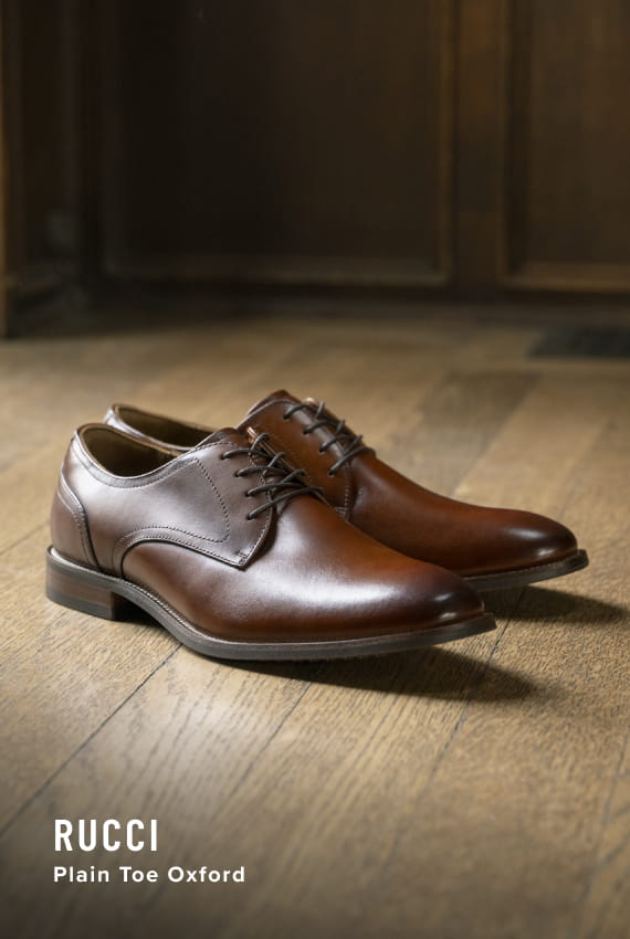 Men's Dress Shoes category. Image features the Rucci plain toe oxford in cognac.