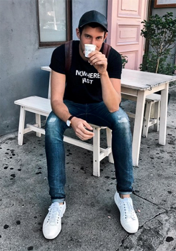 Image of blogger Caleb Thill sitting down wearing the Forward Plain Toe Lace Up Sneaker.