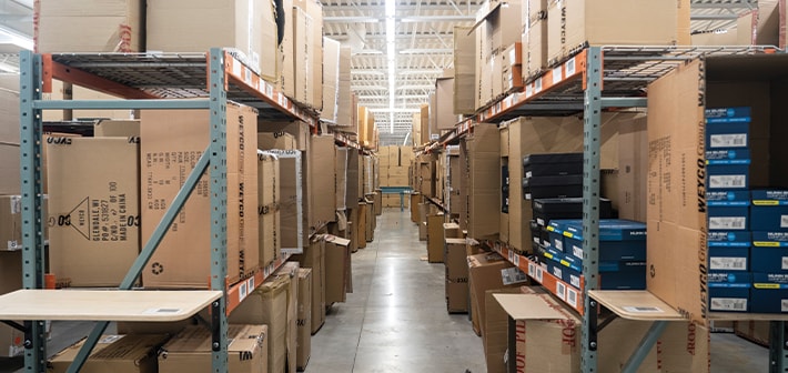 The featured image shows shelved boxes in the Weyco Group warehouse.