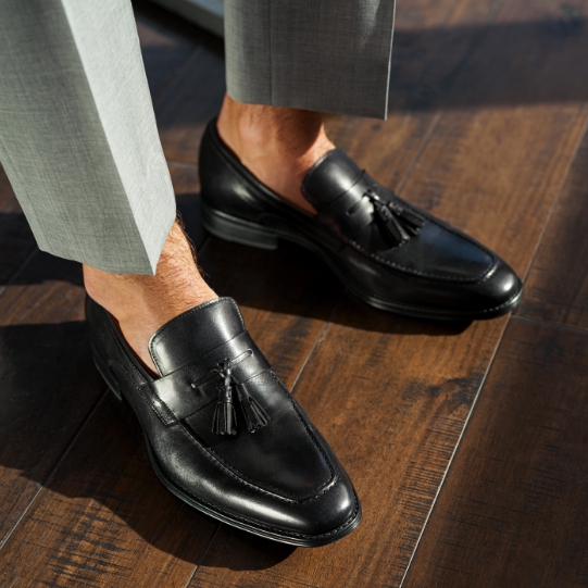 "How To Get Your Black Tie Attire Right When Wearing A Tuxedo." The featured product is the Amelio Moc Toe Tassel Slip On in Black.