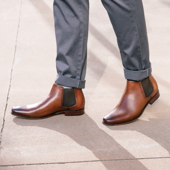 "The History Of Men’s Chelsea Boots." The featured product is the Palermo Plain Toe Gore Boot in Cognac.