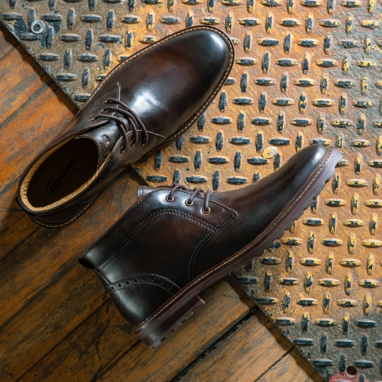 "Men’s Boots: A Storied History." The featured product is the Estabrook Plain Toe Chukka Boot in Brown Crazy Horse.