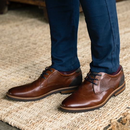 "Wide Shoes, The First Step To True Comfort." The featured product is the Highland II Plain Toe Oxford in Cognac.