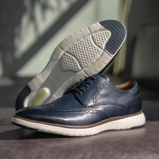 "Wingtip Shoes: A History". The featured product is the Flair Wingtip Oxford in Navy.