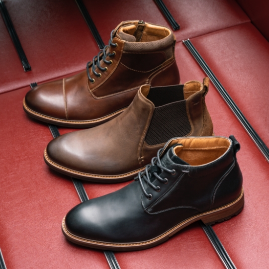 "Men's Boots Throughout The Years." The featured products are the Lodge Cap Toe Lace Up Boot in Brown Crazy Horse, Lodge Plain Toe Gore Boot in Brown Crazy Horse, and Field Plain Toe Chukka Boot in Black Crazy Horse.