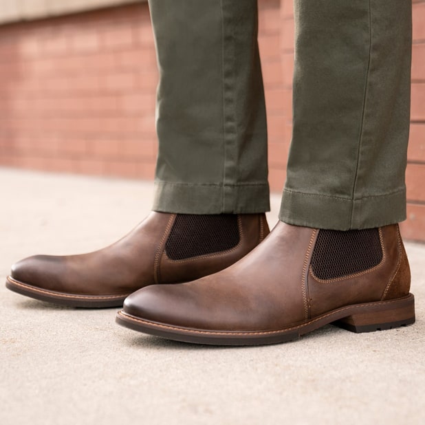 "Business Casual Outfits That Take You From The Work Day To "Off The Clock"". The featured image is a model wearing dress shoes.