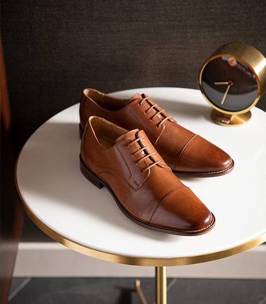 The featured image is the Montinaro Cap Toe Oxford in Cognac in Saddle Tan sitting on a table.