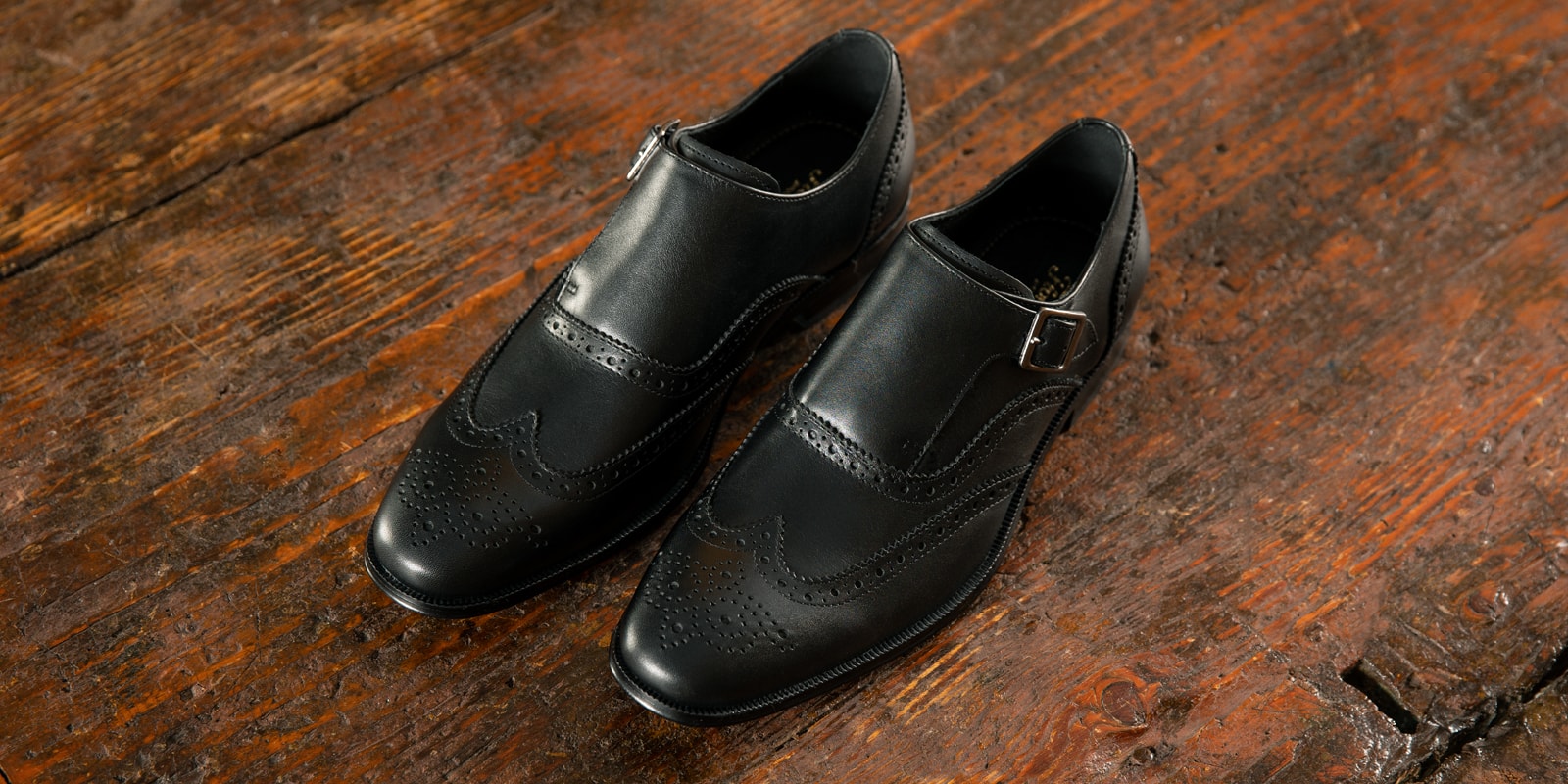 The featured image is a man wearing the Postino Moc Toe Bit Slip On in Black.